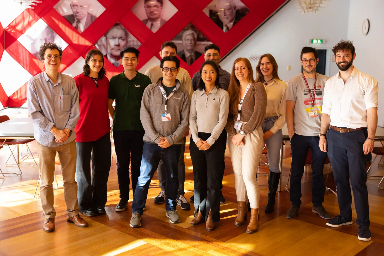 Group of people posing for photo in a conference room